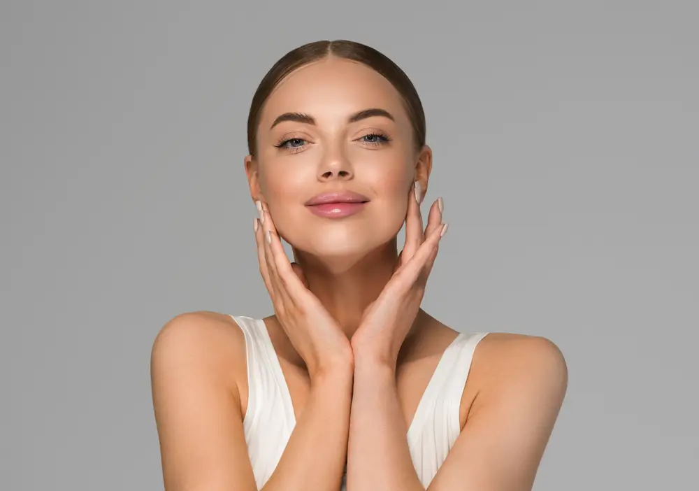 Woman with clear skin smiling confidently.